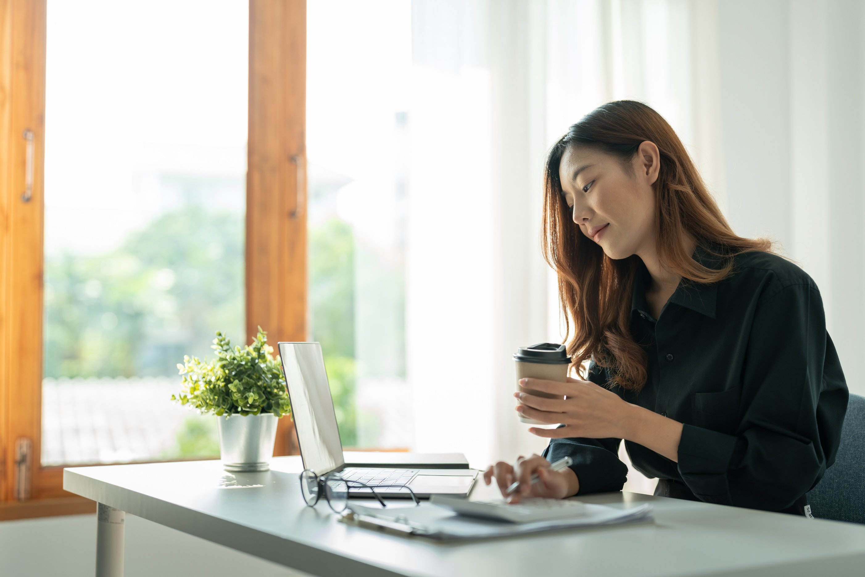 Asian small business owner working at home office. Business